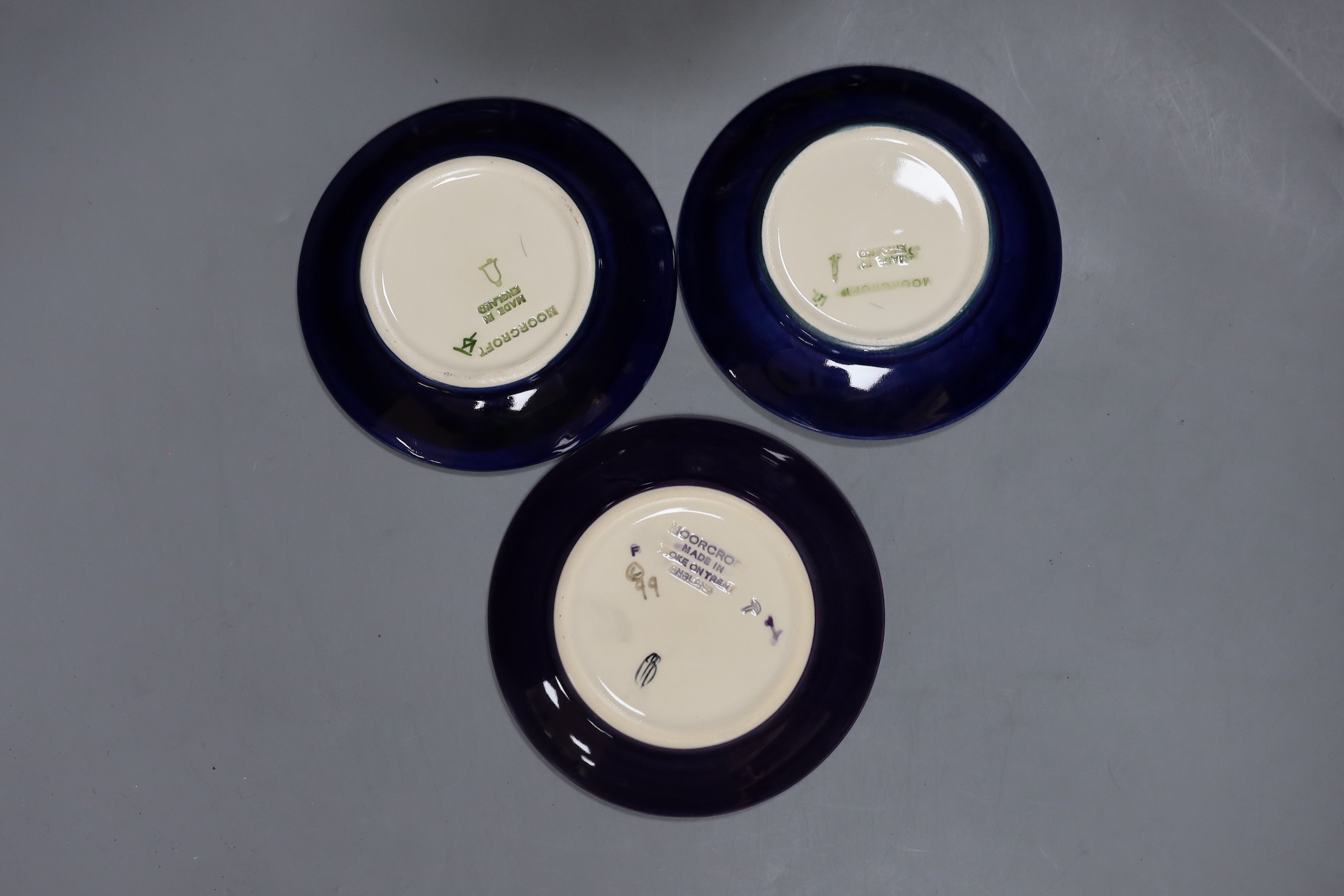 Five Moorcroft pottery dishes and a timepiece